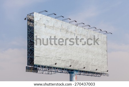 The view of old blank advertising billboard with blue sky background
