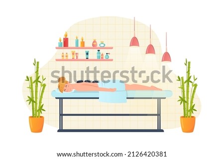 Woman getting massage in spa salon flat concept people scene. Happy client lies on couch under towel and young girl enjoys hot stone and body treatment. Vector illustration for web banner design
