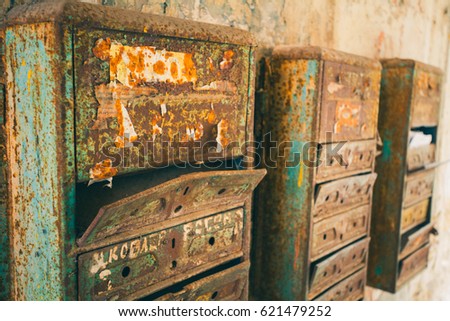 Similar – Image, Stock Photo old, pasted mailbox slot with a flap that says “LETTERS”, made of metal in an old wooden door, where the brown paint is peeling off / write letter / e-mail / mailbox company