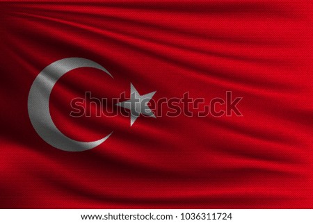The national flag of Turkey. The symbol of the state on wavy cotton fabric. Realistic vector illustration.