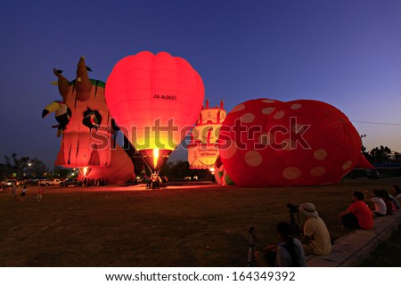 CHIANGMAI, THAILAND-NOVEMBER 23 : People come to watch the release of balloons in the night at Thailand International Balloon Festival in Chiang Mai on November 23, 2012 in Chiangmai,Thailand