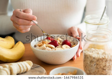 Similar – Image, Stock Photo Healthy breakfast. Bowl with cereals, raspberries and blueberries next to oranges