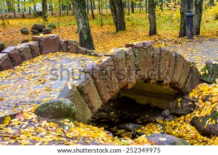 Autumn Park,falling from trees, leaves,stone bridge,river,sadness