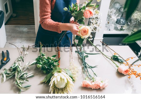 Similar – Image, Stock Photo Unrecognizable female professional florist making bouquets.