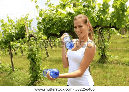 Similar – Image, Stock Photo Woman practicing weightlifting in the gym