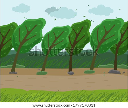 Strong wind and heavy fall of the leaves in the forest. Autumn wind blowing in the park. Green trees bend to the ground from strong winds, the sky is filled with clouds, Empty park in bad weather