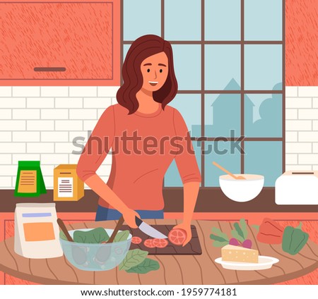 Woman preparing salad using vegetarian ingredients in kitchen. Proper nutrition, healthy lifestyle and vegetarianism concept. Process of cooking vegetarian food. Girl cuts vegetables for healthy dish
