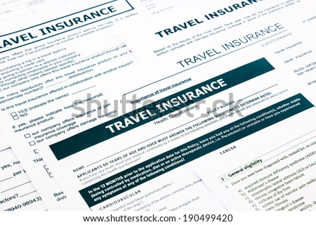 travel insurance form, paperwork and questionnaire for insurance concepts
