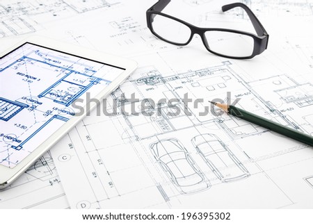 house blueprints and floor plan with tablet, architecture business concepts and ideas