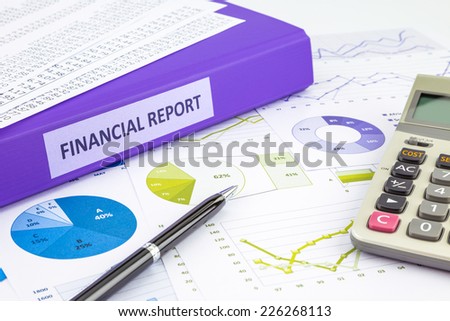 Purple binder of financial report place on graphs and charts  analysis or business reports, concept to budget management
