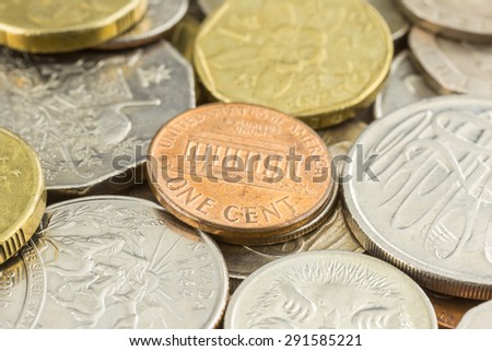 Close up money and world coins focus on one cent coin of United states of america.