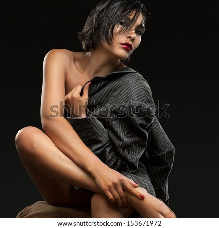 Stylish young woman in a jacket, clothed the naked body.