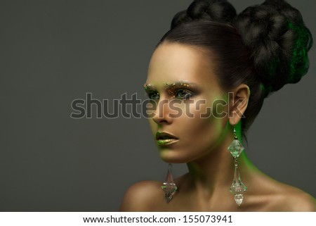 austere beauty portrait of a girl in a green glow. looks into the distance.