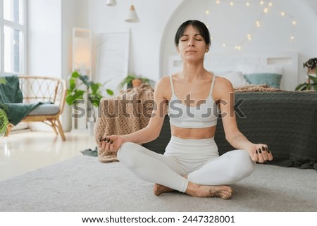 Similar – Image, Stock Photo Young girl doing yoga fitness exercise outdoor in beautiful mountains landscape. Morning sunrise, Namaste Lotus pose. Meditation and Relax. Healthy Lifestyle.