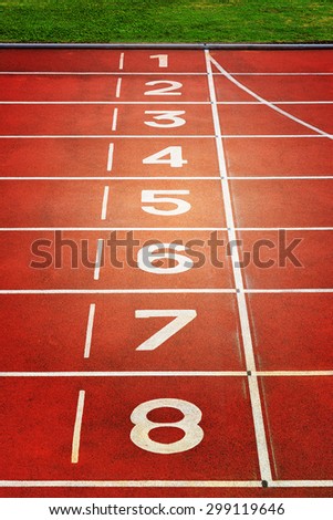Red running tracks in sport stadium