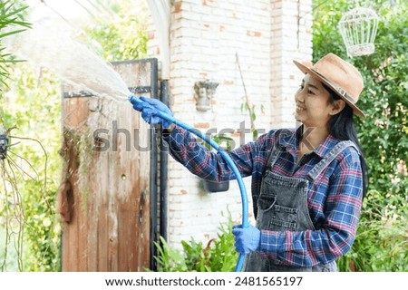 Similar – Image, Stock Photo Woman with water hose