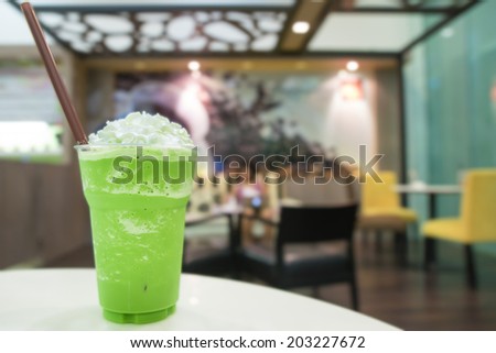 Green tea smoothie with whipped cream