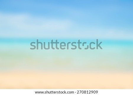 Blurred nature background. Sandy beach backdrop with turquoise water and bright sun light. Summer, Holidays, Vacation, Travel concept.