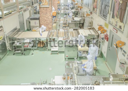 Sapporo - MAY 11: Worker working at Ishiya chocolate factory in May 11, 2015 Sapporo, Japan.