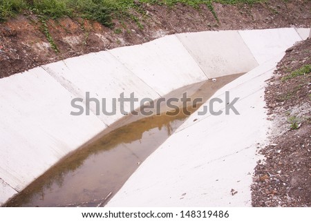 LOP BURI ,THAILAND - JULY 29 : Concret water canal  for urban drainage system and drain flood control on July 29, 2013 in Lop Buri, Thailand.