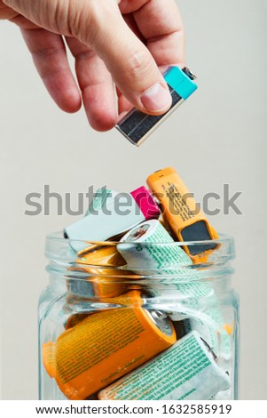 Similar – Image, Stock Photo Jar filled with discharged used batteries. Waste disposal and recycling. Separating the waste