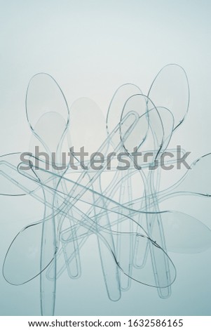 Similar – Image, Stock Photo Plastic spoons scattered over black background