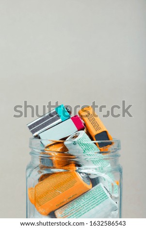 Similar – Image, Stock Photo Jar filled with discharged used batteries. Waste disposal and recycling. Separating the waste