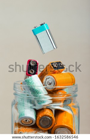 Similar – Image, Stock Photo Jar filled with discharged used batteries. Waste disposal and recycling. Separating the waste