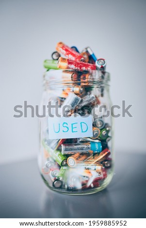 Image, Stock Photo Jar filled with discharged used batteries. Waste disposal and recycling. Separating the waste