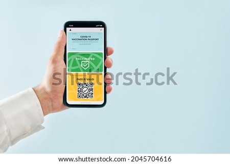 Digital covid certificate. Covid negative rapid digital test pass. Woman passenger holding digital medical pass on her mobile phone, passport and airplane ticket. Traveler showing digital covid test