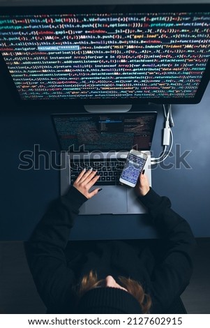 Similar – Image, Stock Photo Cyber security threat. Young woman using computer and coding. Internet and network security. Stealing private information. Person using technology to steal password and private data