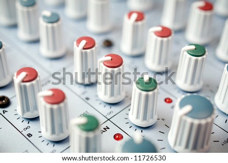 Mixing desk - macro detail of a studio mixing console.