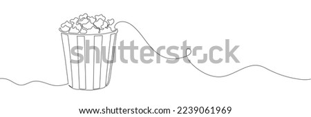 Popcorn in a cup continuous one line drawing. Vector illustrationPopcorn in a cup continuous one line drawing