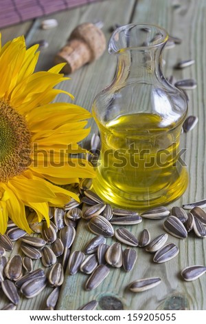 bottle with sunflower oil, sunflower seeds and sunflower