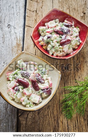 bean salad, crab meat, eggs and dill in dishes