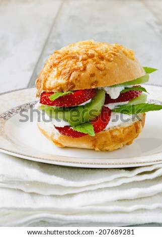 vitamin sandwich of cottage cheese and various fruits on a plate. health and diet concept