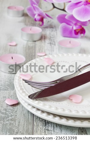 holiday table valentines day. dishes, candles and flowers. holidays & events. selective focus