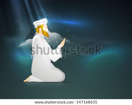 Young Muslim man praying (Namaz, Islamic prayer) in the blue sky background.