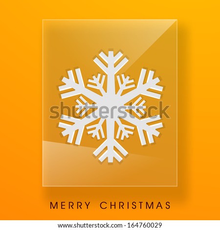 Merry Christmas celebration concept with beautiful snowflake on glass, bright yellow background.