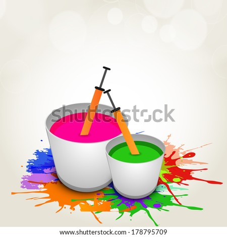 Indian colour festival Happy Holi celebrations concept with buckets full of water colours and pickari on splash background.