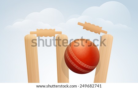 Red Cricket ball hitting the wicket stumps on cloudy background for sports concept.