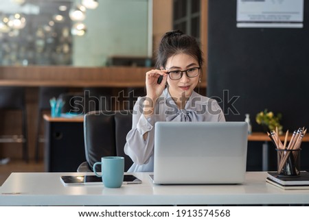 Similar – Image, Stock Photo Woman with glasses using smartphone outdoor