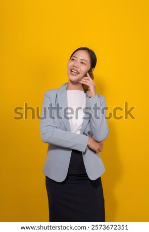 Similar – Image, Stock Photo Businesswoman having smartphone conversation near gray wall