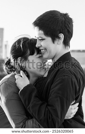 Similar – Image, Stock Photo Delighted black lesbian couple taking selfie on smartphone