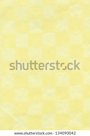 High resolution scan of rice paper checkered with beige & pastel yellow.