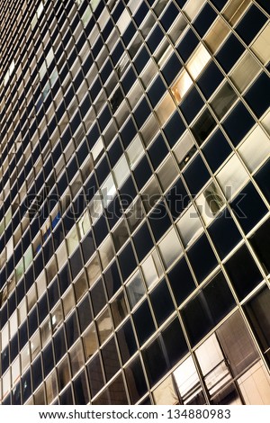 Office building's curtain wall at night, shot from an extreme low and wide angle. Good for backgrounds.