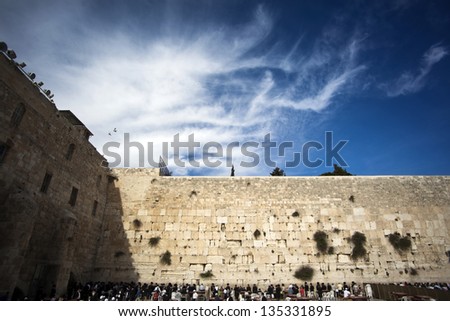 JERUSALEM - MAY 21: Prayers at the Western Wall, one of the most sacred places to the Jewish religion on May 21 2010 in Jerusalem, Israel.