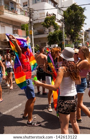 TEL-AVIV - JUN 7: People partying at the annual gay parade in the streets of Tel-Aviv, Israel on June 7, 2013.