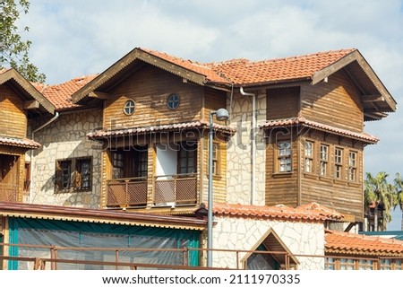 view of the old r ancient house with red roof and trees by the sea in Turkey. Side  is populer tourist destination in Turkey. Photo stock © 
