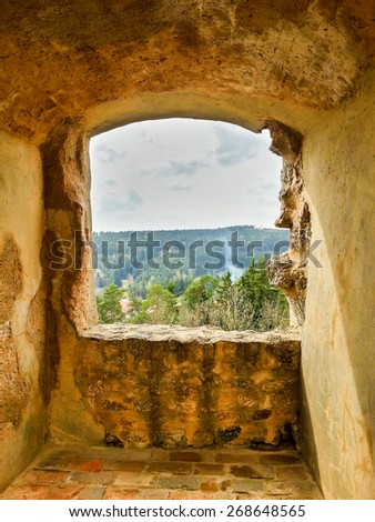 Look through the old stone castle window.